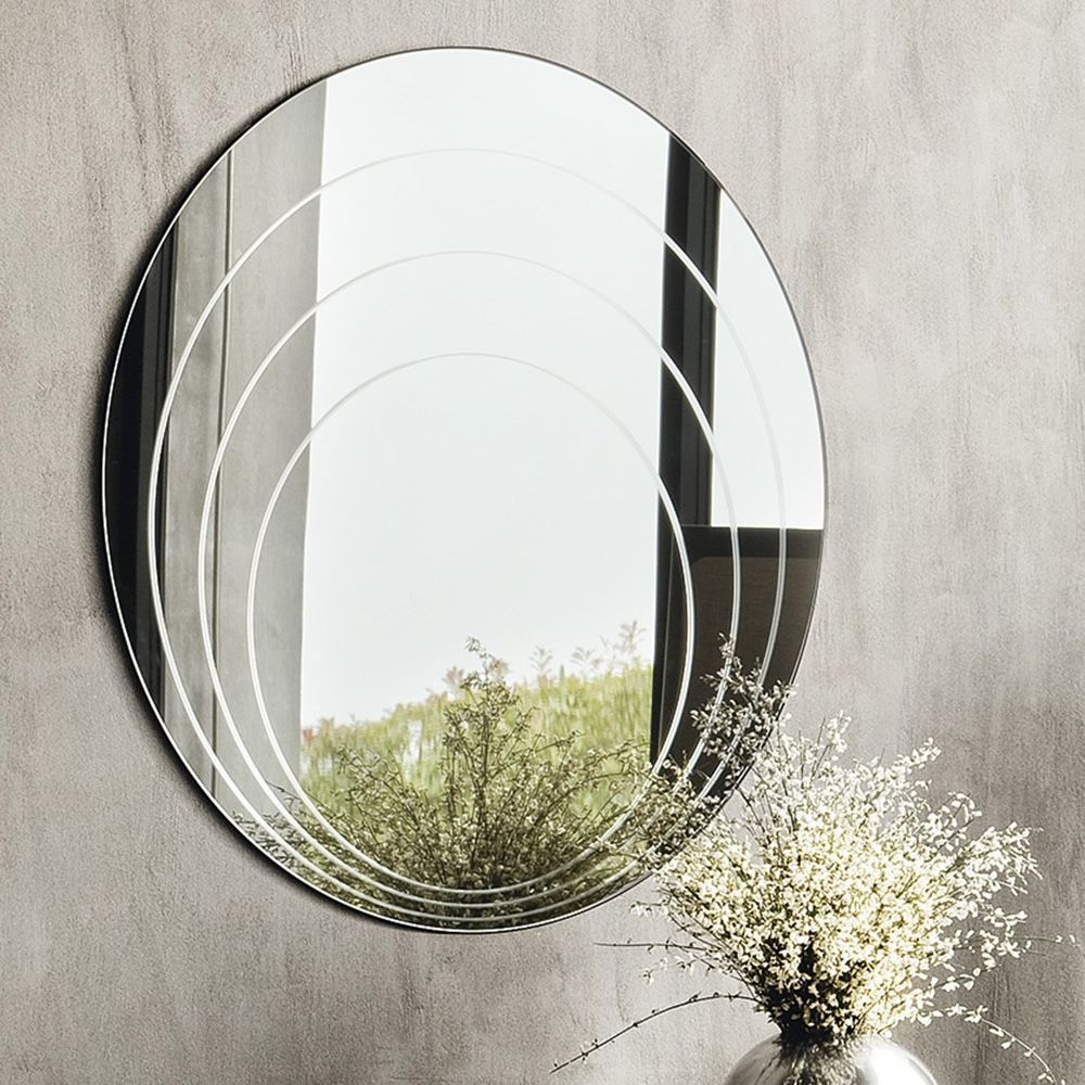 specchio a parete circolare con inserti concentrici
